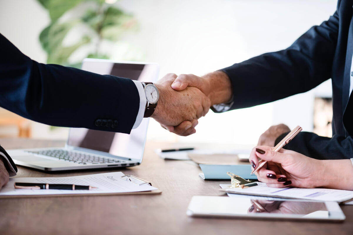 closeup of two people shaking hands