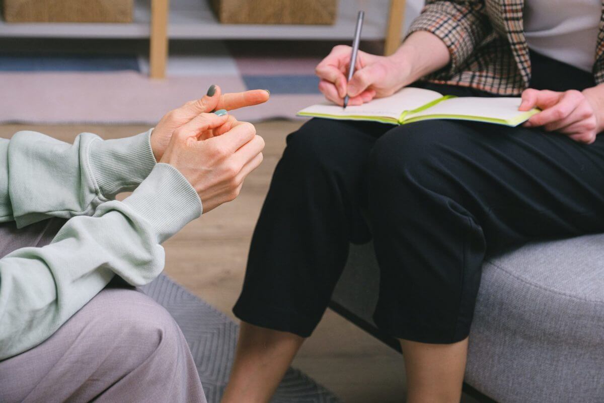 two people interview with a closeup of their hands