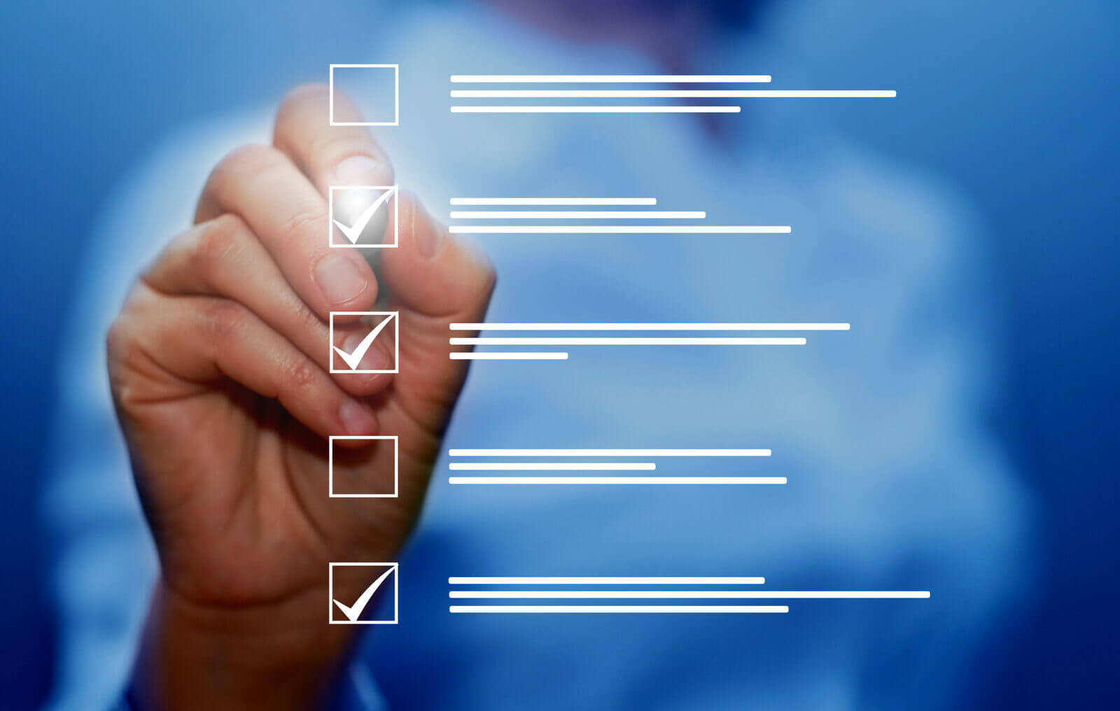 a hand checking off a step-by-step list on how to write a cover letter.