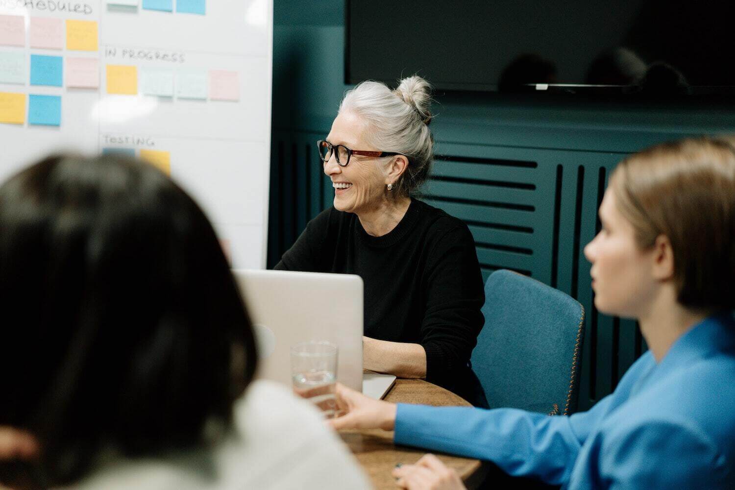 woman working with a group of the companies top talent