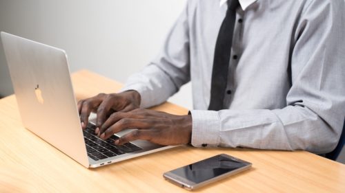 A passive job seeker typing on computer