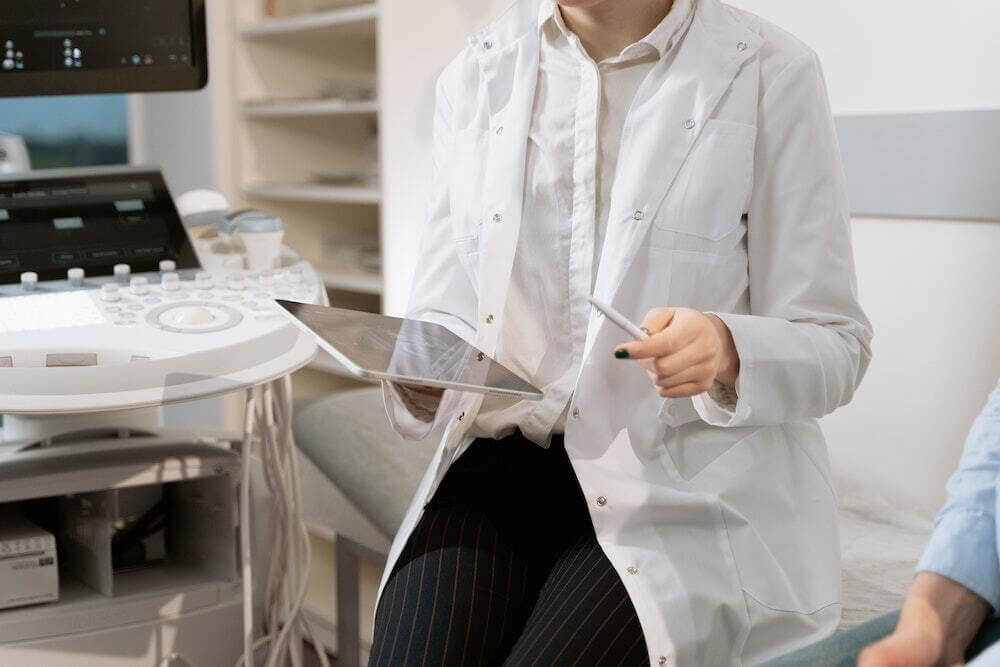 a person sitting in a room where healthcare technology is shown throughout