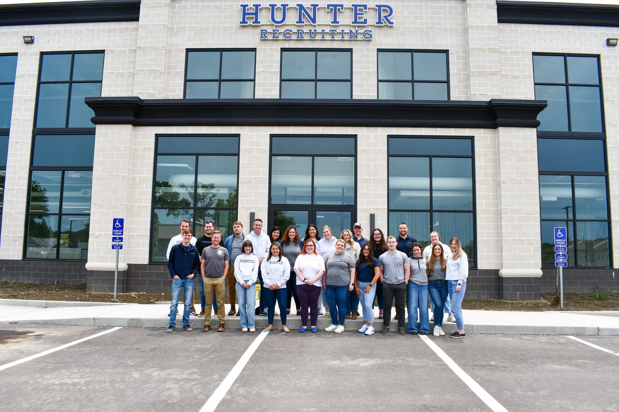 Group of employees outside of Hunter International headquarters building