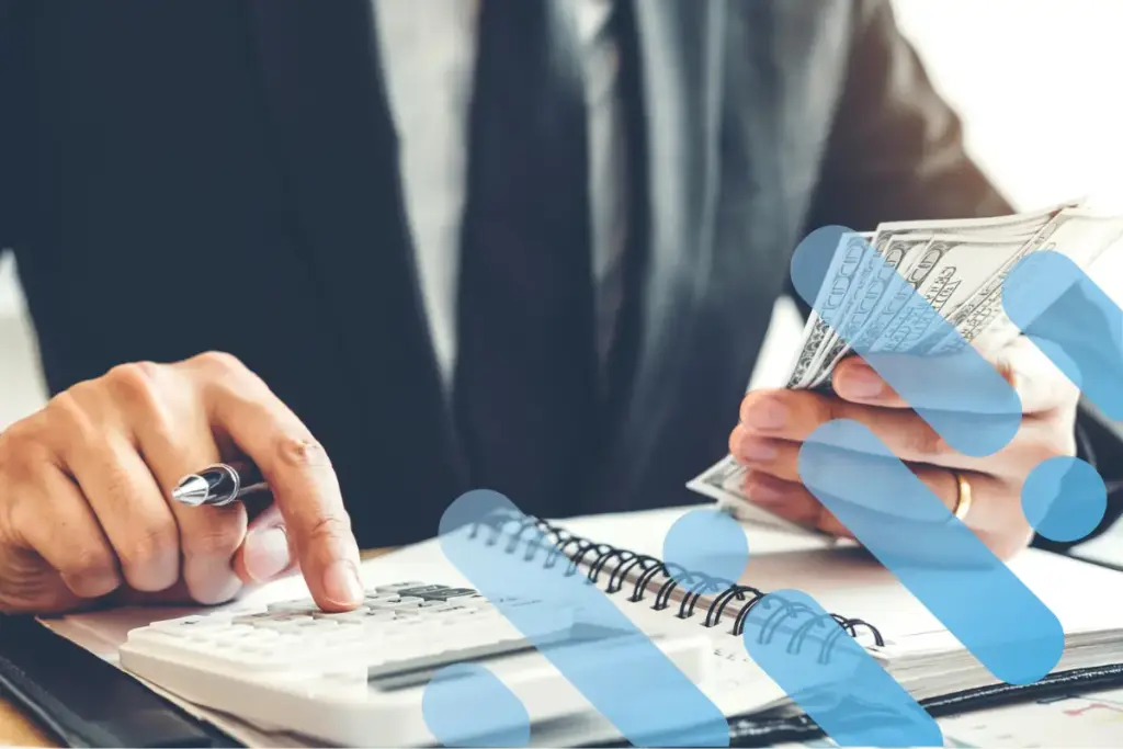 Executive holding money and doing calculations on calculator with branding overlay.