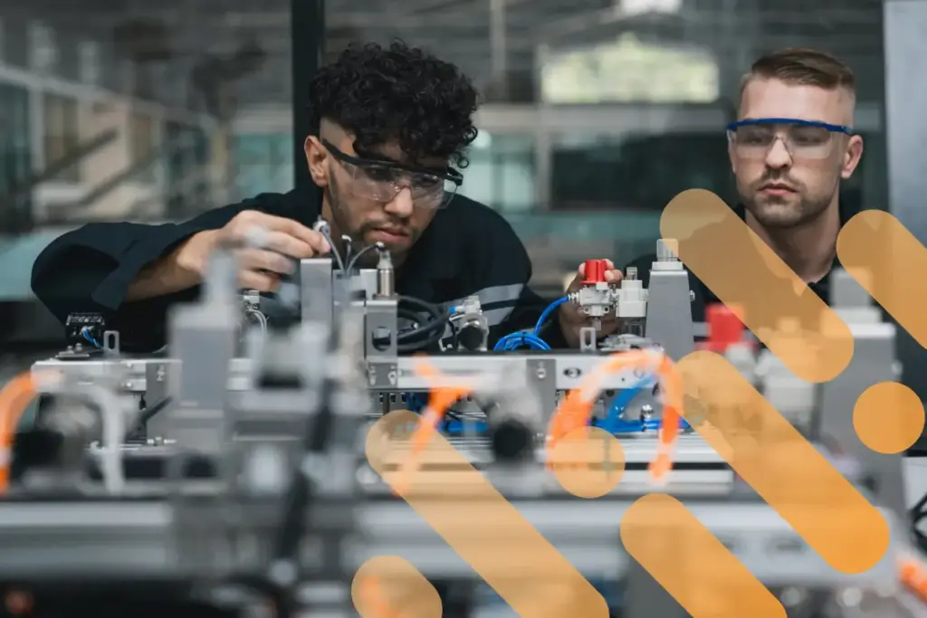 Mechatronics engineers are working on a robot with branding overlay.