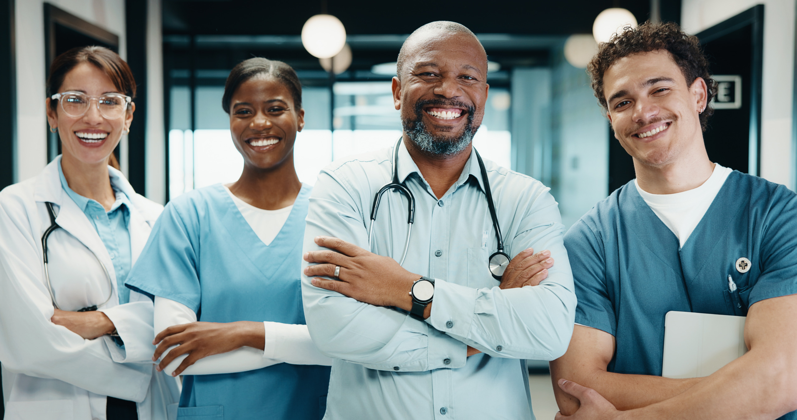 Smile, crossed arms and portrait of doctors and nurses in hospital with confidence for medical career. People, professional and group of healthcare employees with pride for about us in clinic. Why Allied Health Staffing Deserves More Attention